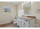 Bathroom with toilet, vanity with drawers and a bright window at 2948 Christy Leigh Dr, Newton, NC 28658
