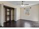 Bedroom featuring dark wood vinyl flooring, great natural light, and open closet space at 2948 Christy Leigh Dr, Newton, NC 28658