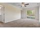 Large bedroom featuring sliding glass doors and a ceiling fan at 2948 Christy Leigh Dr, Newton, NC 28658