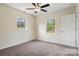 This bedroom features neutral walls, carpet floors, natural light and ceiling fan at 2948 Christy Leigh Dr, Newton, NC 28658