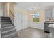 Bright dining area features modern wainscoting, gray vinyl floors, and a stylish light fixture at 2948 Christy Leigh Dr, Newton, NC 28658