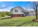 Two-story home with landscaped lawn, brick foundation, and inviting front porch at 2948 Christy Leigh Dr, Newton, NC 28658