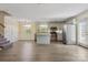 Bright, open kitchen featuring gray cabinets, stainless steel appliances, center island, wood floors, and natural light at 2948 Christy Leigh Dr, Newton, NC 28658