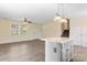 Open living room boasts natural light, gray vinyl floors, and a view to the stairway at 2948 Christy Leigh Dr, Newton, NC 28658