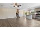 Spacious living area with wood-look floors connecting to a kitchen with stainless steel appliances, cabinets, and island at 2948 Christy Leigh Dr, Newton, NC 28658
