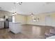 Open layout showcasing kitchen with island flowing into the bright living room with luxury vinyl flooring at 2948 Christy Leigh Dr, Newton, NC 28658