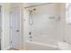 Clean bathroom shower tub with shower head and storage space at 2948 Christy Leigh Dr, Newton, NC 28658