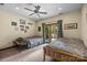Comfortable bedroom featuring a ceiling fan and sliding glass door to the outside at 307 Stillwater Rd, Troutman, NC 28166