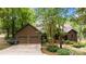 Charming home features a two-car garage, mature trees and manicured landscaping at 307 Stillwater Rd, Troutman, NC 28166