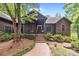 Charming home with covered porch, brick walkway, and lush landscaping at 307 Stillwater Rd, Troutman, NC 28166