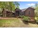 Wood-sided home with brick pathway, mature tree and landscaping at 307 Stillwater Rd, Troutman, NC 28166