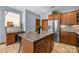 A well-equipped kitchen showcases stainless steel appliances, custom cabinetry, and a center island, perfect for culinary enthusiasts at 307 Stillwater Rd, Troutman, NC 28166