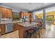 Spacious kitchen with wood cabinets, island with seating, stainless appliances and modern backsplash at 307 Stillwater Rd, Troutman, NC 28166