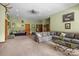 Generously sized living area features hardwood floors, a cozy seating arrangement, and is decorated with sports memorabilia and artwork at 307 Stillwater Rd, Troutman, NC 28166
