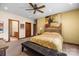 Spacious main bedroom with ceiling fan and attached bathroom for convenience at 307 Stillwater Rd, Troutman, NC 28166