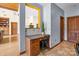 A cozy office nook offers a practical workspace with a desk, storage, and a view of the home's open-concept layout at 307 Stillwater Rd, Troutman, NC 28166