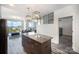 A modern kitchen has an open layout with an island, and it connects to a dining and living room at 333 W Trade St # 1802, Charlotte, NC 28202