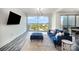Bright living area with hardwood floors, large windows offering cityscape views and stylish decor at 333 W Trade St # 1802, Charlotte, NC 28202