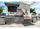 Outdoor kitchen area featuring a grill, TV, and countertop space, ideal for entertaining at 333 W Trade St # 1802, Charlotte, NC 28202