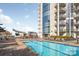 Beautiful rooftop pool with lounge chairs and city views; perfect for relaxation and entertaining at 333 W Trade St # 1802, Charlotte, NC 28202