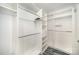 Organized walk-in closet with custom shelving, drawers, and ample hanging space at 333 W Trade St # 1802, Charlotte, NC 28202