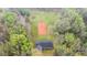 Aerial view of home with surrounding wooded property and garden area at 3720 Lanes Creek Rd, Marshville, NC 28103