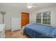 Bright bedroom with hardwood floors, natural light, and a closet for ample storage at 3720 Lanes Creek Rd, Marshville, NC 28103