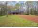 Charming brick home with a welcoming front porch and a large yard perfect for gardening at 3720 Lanes Creek Rd, Marshville, NC 28103