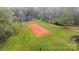 Aerial view of the property with a home, cleared land and surrounded by dense trees at 3720 Lanes Creek Rd, Marshville, NC 28103