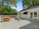 Outdoor deck with dining and lounge areas, perfect for entertaining and relaxation at 3911 Kitley Pl, Charlotte, NC 28210