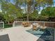 Back deck with dining and lounge spaces offers a serene outdoor living experience at 3911 Kitley Pl, Charlotte, NC 28210