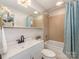 Well-lit bathroom featuring a tub/shower, modern vanity, and decorative accents at 3911 Kitley Pl, Charlotte, NC 28210