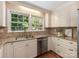 Bright kitchen featuring granite countertops and white cabinets at 3911 Kitley Pl, Charlotte, NC 28210