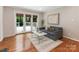 Bright living room with sliding glass doors to outdoor patio at 3911 Kitley Pl, Charlotte, NC 28210