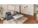 Relaxing living room with a comfortable sofa, stylish coffee table, and natural light filtering through the windows at 3911 Kitley Pl, Charlotte, NC 28210