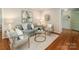 Inviting living room with neutral decor, hardwood floors and natural lighting at 3911 Kitley Pl, Charlotte, NC 28210