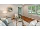 Comfortable living room with a decorative mirror and hardwood floors at 3911 Kitley Pl, Charlotte, NC 28210