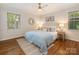 Inviting main bedroom with a luxurious bed, natural light, and stylish decor at 3911 Kitley Pl, Charlotte, NC 28210