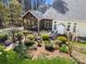 Aerial view of the home highlighting the deck, screened porch, and meticulously landscaped backyard at 4098 Kiser Cove Ln, Terrell, NC 28682