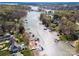 Aerial view of lakefront homes with docks, showcasing community's waterfront location and amenities at 4098 Kiser Cove Ln, Terrell, NC 28682