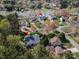 Aerial view of a neighborhood, highlighting homes nestled among trees and near the lake at 4098 Kiser Cove Ln, Terrell, NC 28682