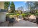 View of a spacious wood deck with room for seating and cooking, and bridge to beautiful backyard at 4098 Kiser Cove Ln, Terrell, NC 28682
