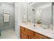 Bathroom with a wood vanity, white countertop, mirror, and linoleum floor at 4098 Kiser Cove Ln, Terrell, NC 28682