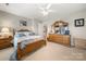 Bedroom with a wood frame bed, neutral paint, and a large dresser at 4098 Kiser Cove Ln, Terrell, NC 28682