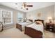 Bedroom with two twin beds, ceiling fan, neutral walls, and carpet at 4098 Kiser Cove Ln, Terrell, NC 28682