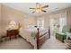 Cozy bedroom with a ceiling fan, two windows, and a comfortable sitting area at 4098 Kiser Cove Ln, Terrell, NC 28682