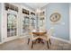 Cozy breakfast nook with a round table, chairs, and lots of natural light at 4098 Kiser Cove Ln, Terrell, NC 28682