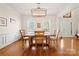 Traditional dining room with a wooden table, chairs, and large windows for natural light at 4098 Kiser Cove Ln, Terrell, NC 28682
