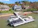 Lakefront dock with multiple boat slips, perfect for boating enthusiasts and enjoying waterfront living at 4098 Kiser Cove Ln, Terrell, NC 28682