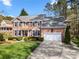 Traditional brick two-story home with a well-manicured lawn, charming shutters, and an attached two-car garage at 4098 Kiser Cove Ln, Terrell, NC 28682